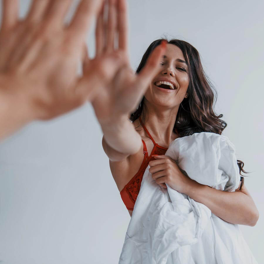 Ginger-U celebrates PCOS management and fertility enhancement, with a woman giving a high-five, representing the positive impact of our health coaching.